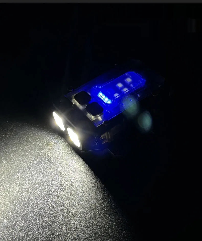 Mini black tactical warning flashlight with USB charging cable for backpack mounting.