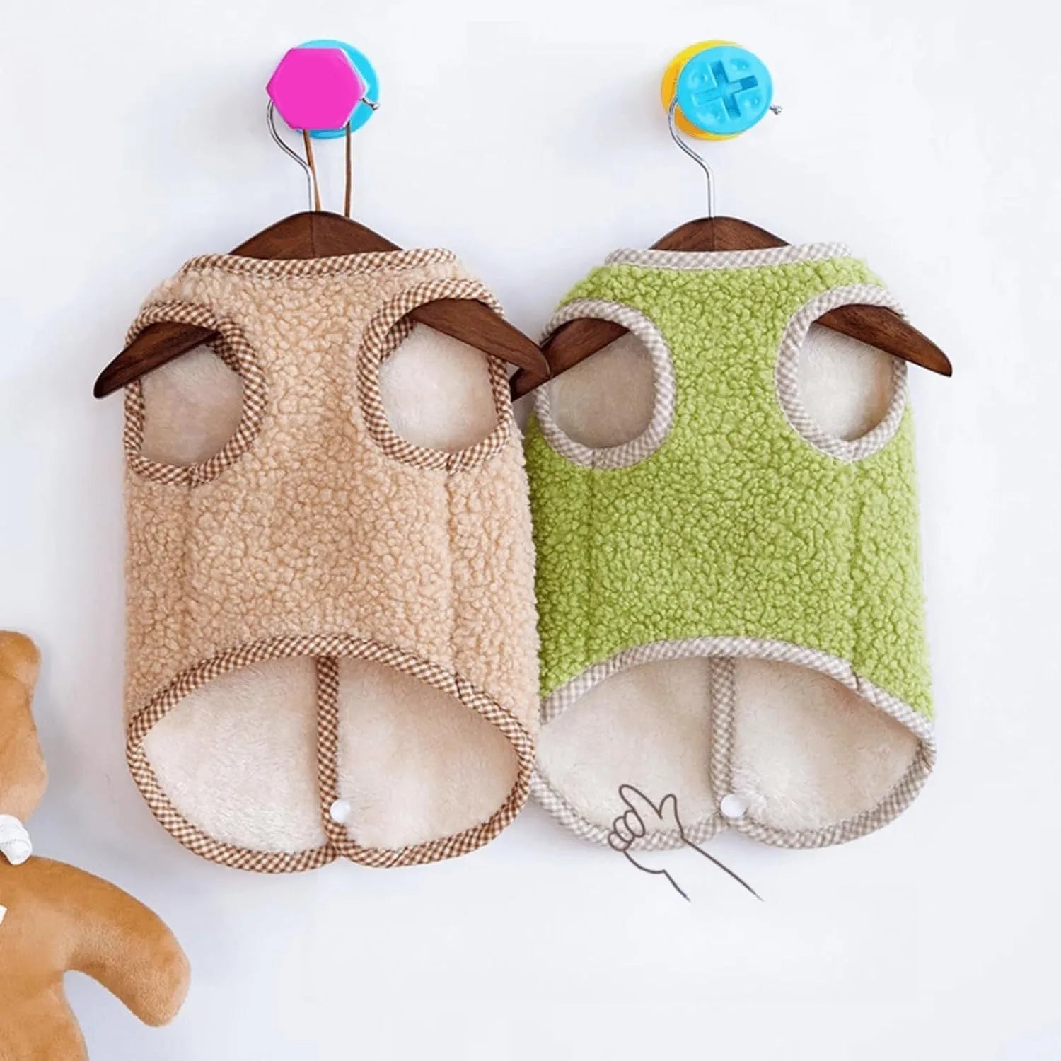 Green coral fleece dog vest with a metal leash ring on the back for a small dog.