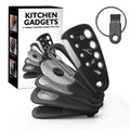 Six stainless steel kitchen gadgets and a brush stored in a modern simple colour box.