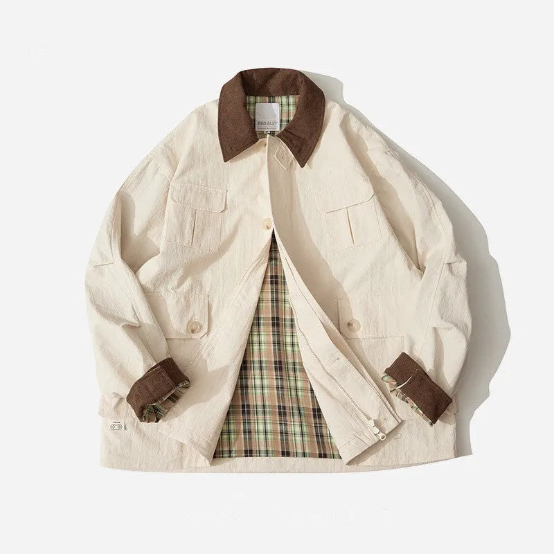 Green casual jacket with side seam pockets on a hanger
