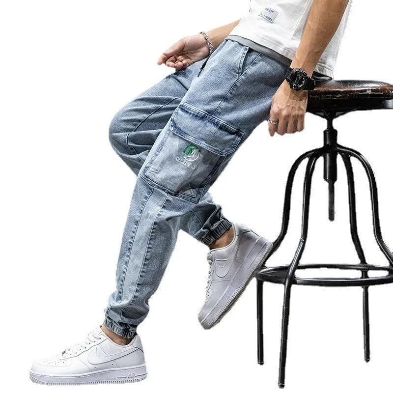 Men's loose fit cargo jeans in Korean style, showing straight leg and mid-waist design.