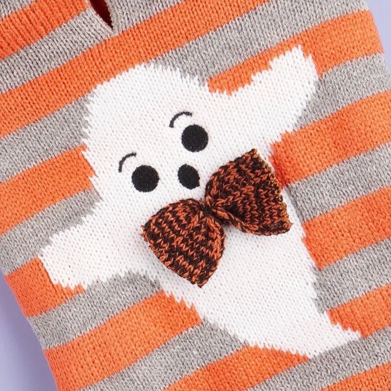 Orange knitted hooded pet sweater with striped pattern and fur balls for Halloween