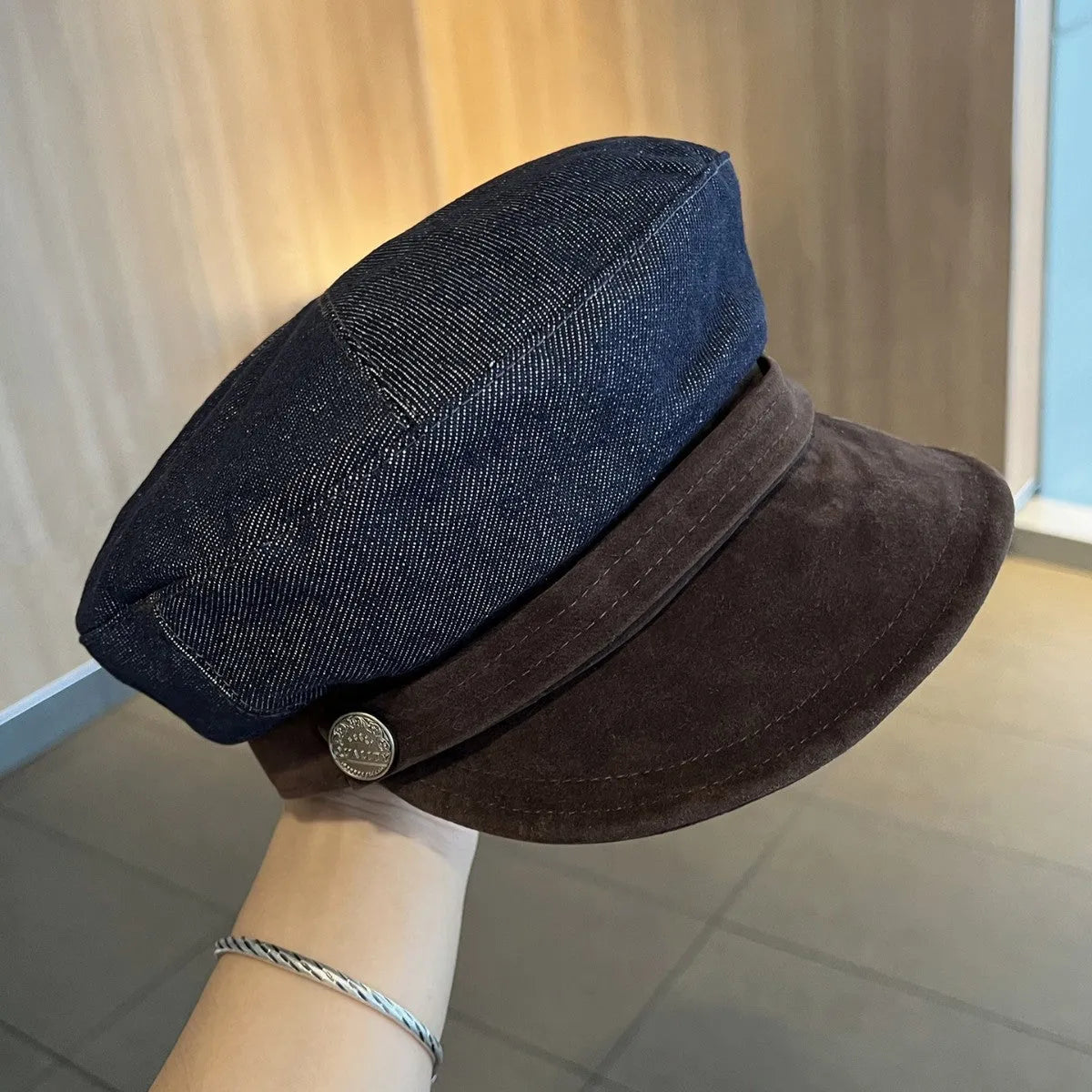 Dark blue denim octagonal newsboy hat with adjustable band and colour trim brim options