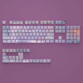Wenshao Sleeping Lotus PBT key cap set showing side-carved light-transmission characters and five-sided sublimation artwork