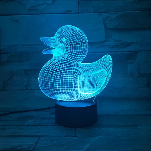 3D cartoon yellow duck LED night light on a table, showing multiple colour options with remote control.
