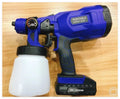 Blue cordless paint spray gun with 800ml cup and 1.8mm nozzle, showing trigger and battery compartment.