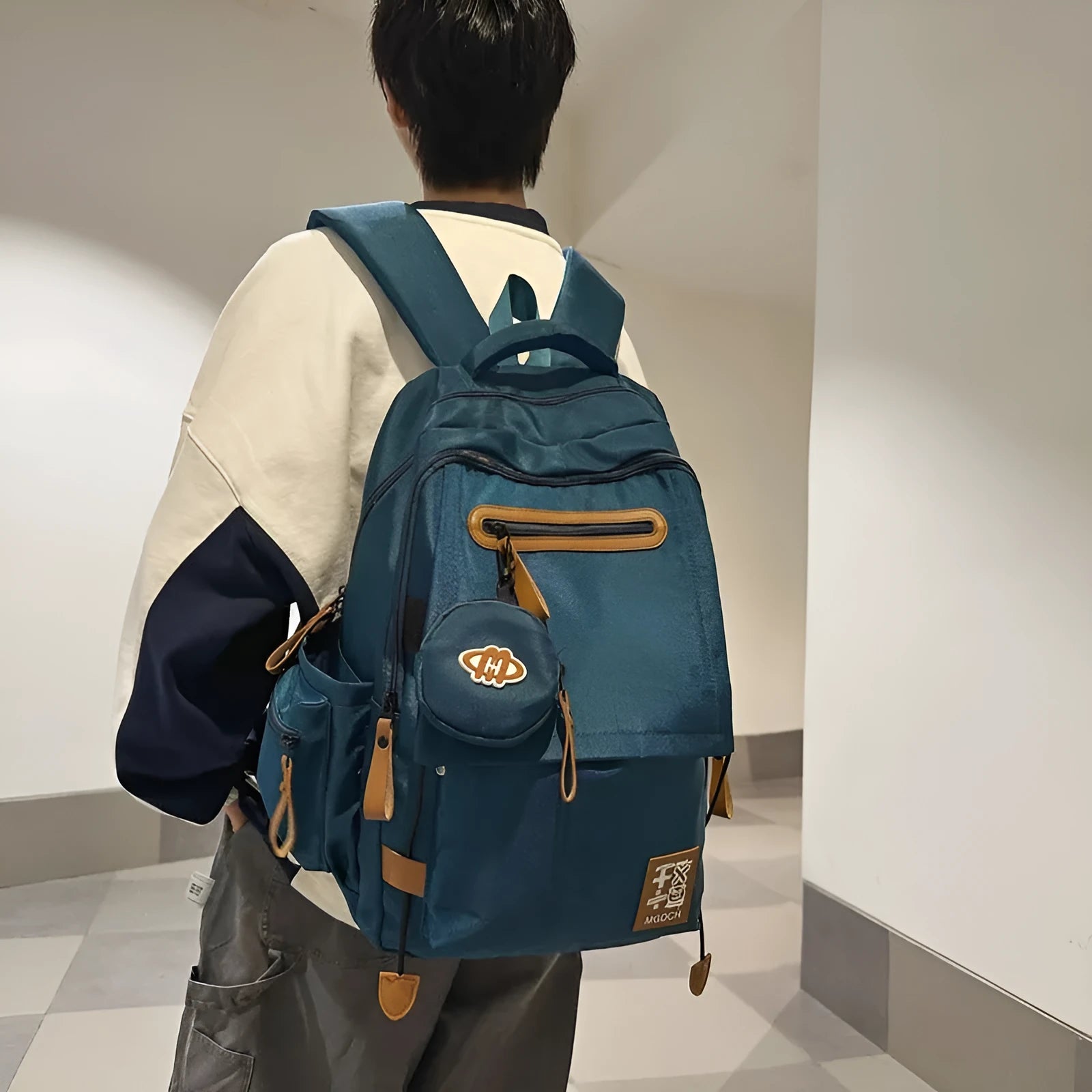 Large nylon school backpack in blue with curved shoulder straps and street style sewing detail