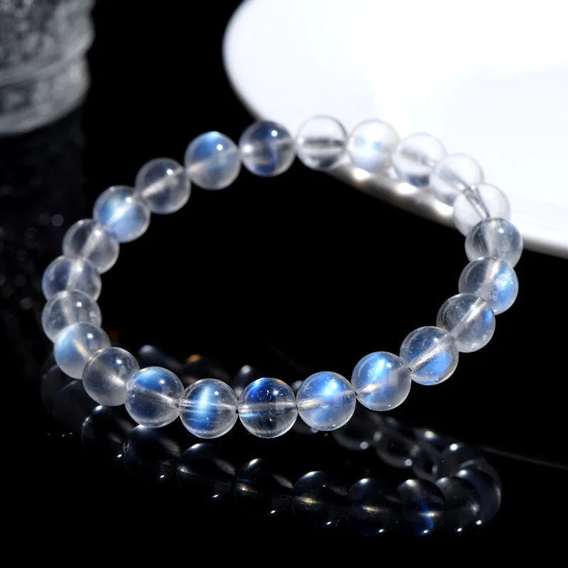 Natural cream body blue moonlight crystal bracelet with grinding finish on wrist