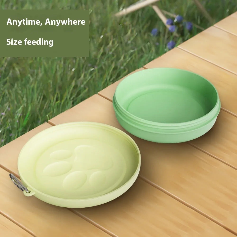 Portable dog food and water bowl with integrated snack box compartments in pink and green colour options.