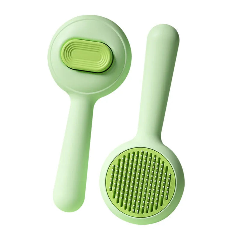 Green and yellow pet grooming brushes with stainless steel pins and rubber handles.