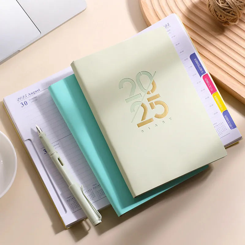 Soft faux leather A5 2025 daily plan schedule book open on Dot Grid paper.