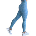 Women's high-waisted push up booty leggings in a camouflage print for fitness and yoga.