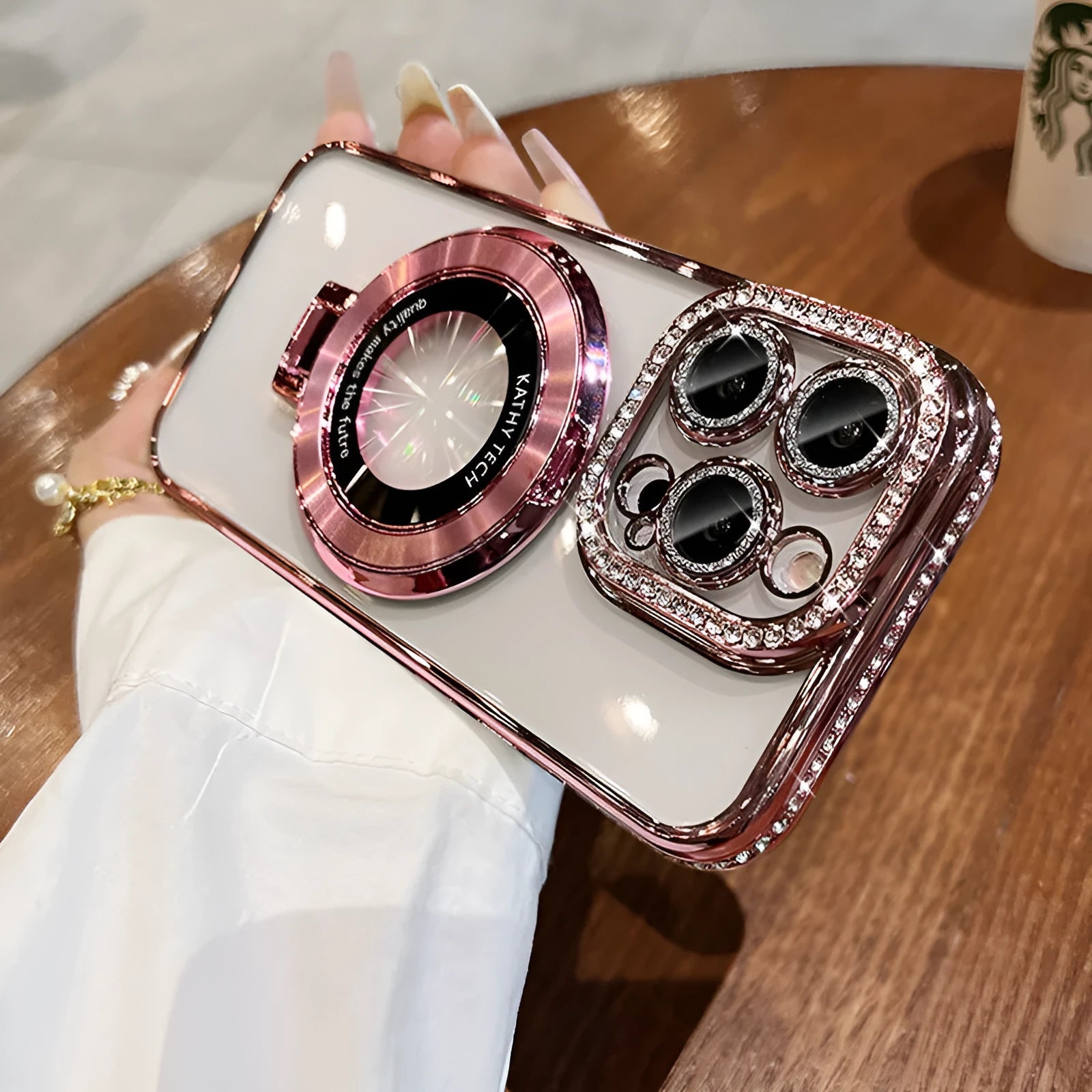 Transparent silicone iPhone case with rhinestone frame and built-in magnetic bracket in purple colour.