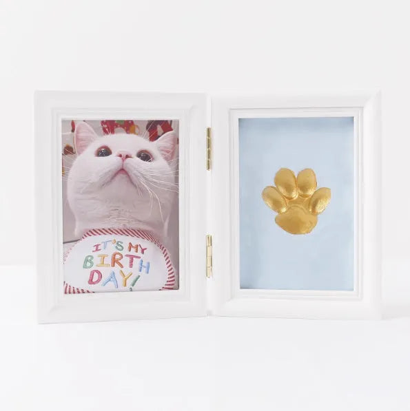 Solid wood cat palm print photo frame with gold lacquer and seal paste kit on table