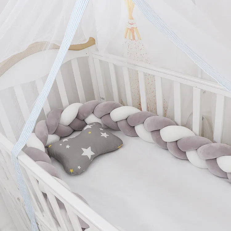 Baby crib bumper braid knot pillow cushion in spandex velvet, shown in a light grey colour