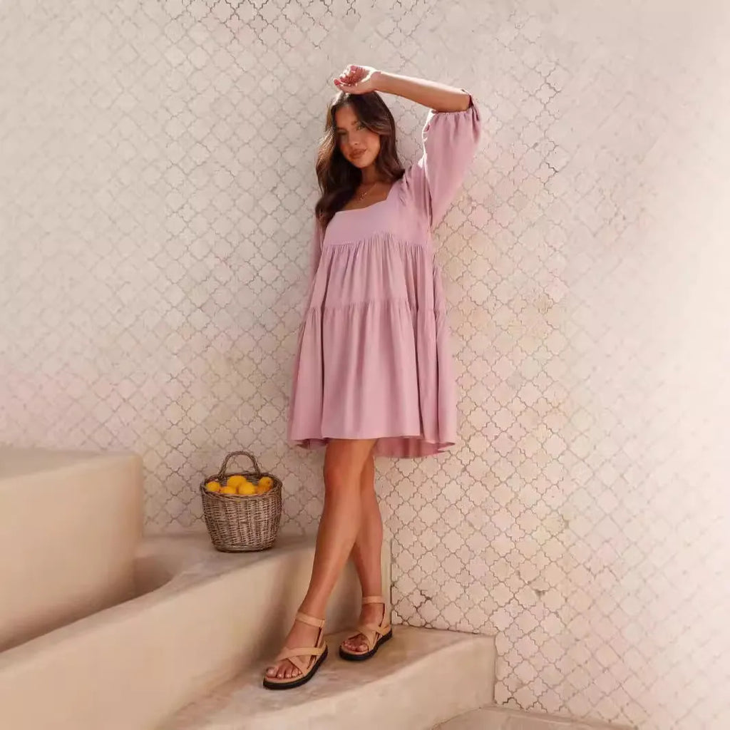Children's orange backless pullover dress with square collar and puff sleeves showing A-line skirt silhouette