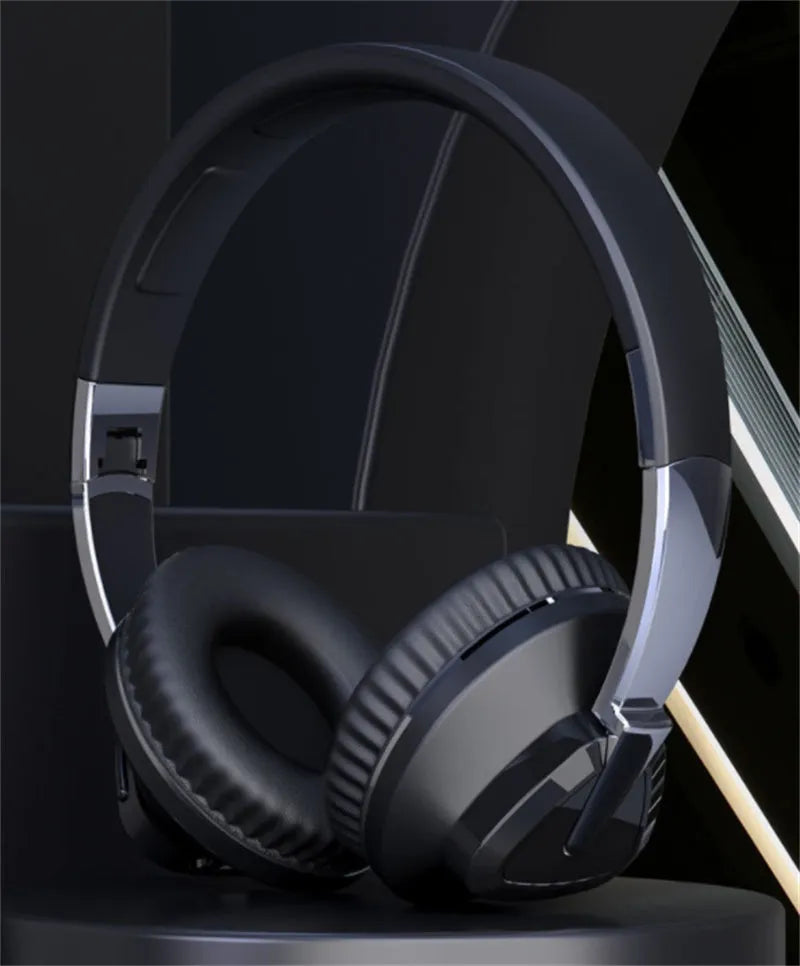 Wireless Bluetooth headset in black colour showing ear cushions with AUX audio jack and control buttons