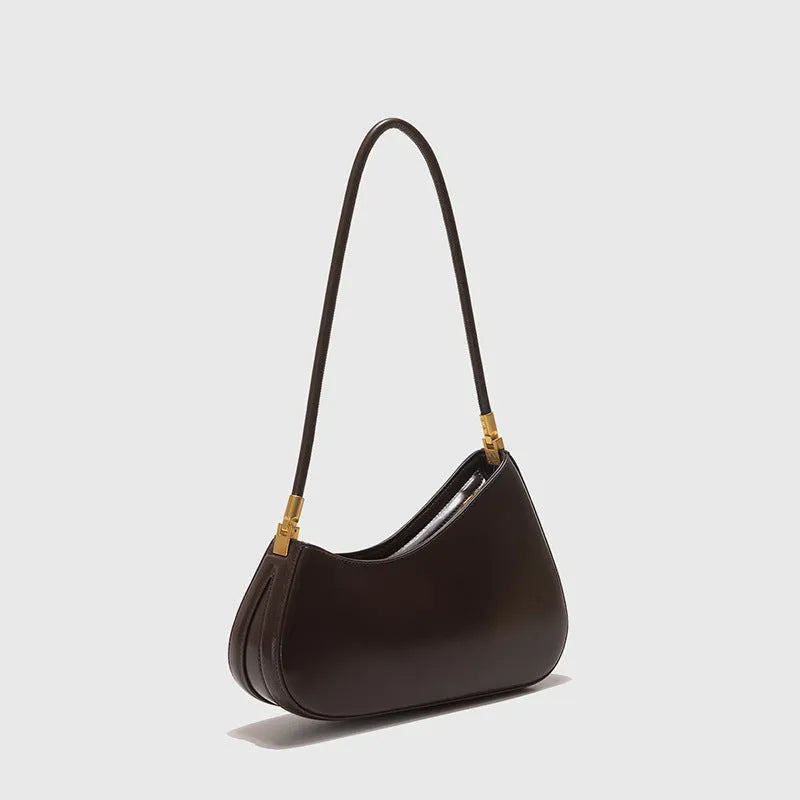 Retro oval women's underarm bag in PU leather with a single shoulder strap and zip pocket.