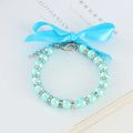 Adjustable pearl and rhinestone dog necklace on a soft ribbon in blue colour