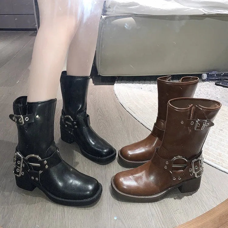 Women's black platform ankle boots with buckle detail and chunky sole