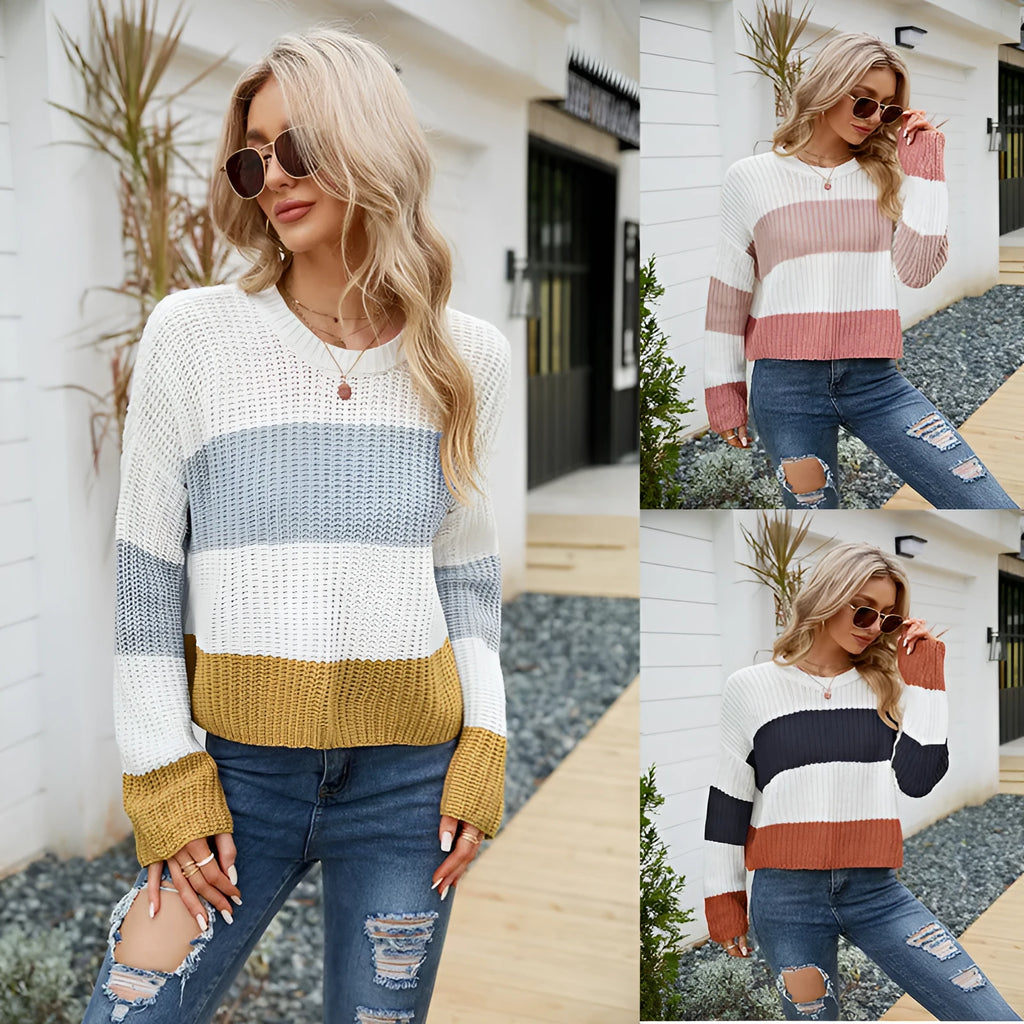 Women's pink and white striped loose fit short sleeve acrylic pullover on a hanger.
