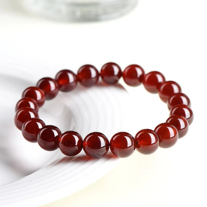 Natural orange red garnet ball crystal bracelet with Ruyi design element in unisex retro style