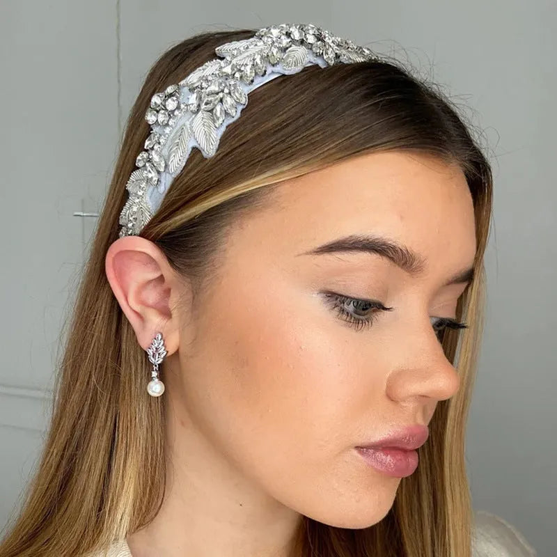 Geometric flower design pearl earrings with micro inlaid zircon stones in gold, platinum, or rose gold plated finishes.