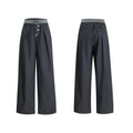 Men's high-waisted straight-leg casual trousers in black with button fly front, showing relaxed fit.