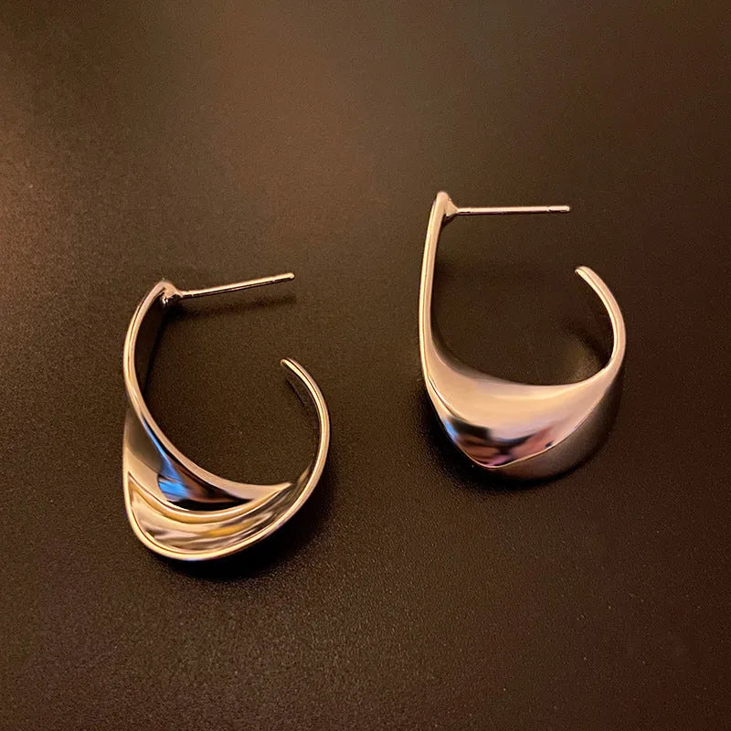 Metal geometric earrings with twisted design in gold or silver electroplated finish