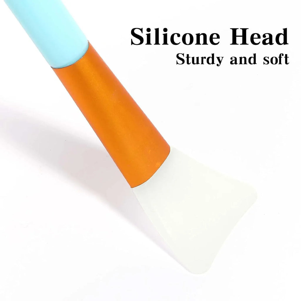 Reusable silicone face mask applicator spatula in six colour options on a clean surface