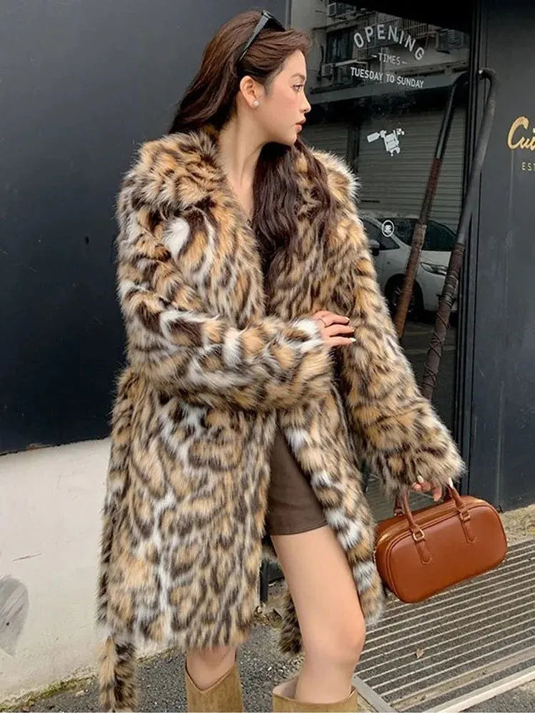 A long faux fur street fashion coat with a fur collar and pockets, shown in an urban setting.