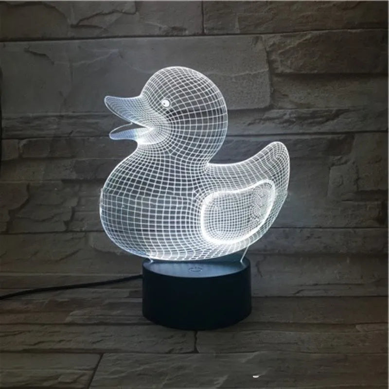 3D cartoon yellow duck LED night light on a table, showing multiple colour options with remote control.