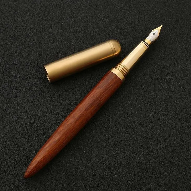 Business fountain pen with stainless steel nib and wooden body in rosewood finish on white background