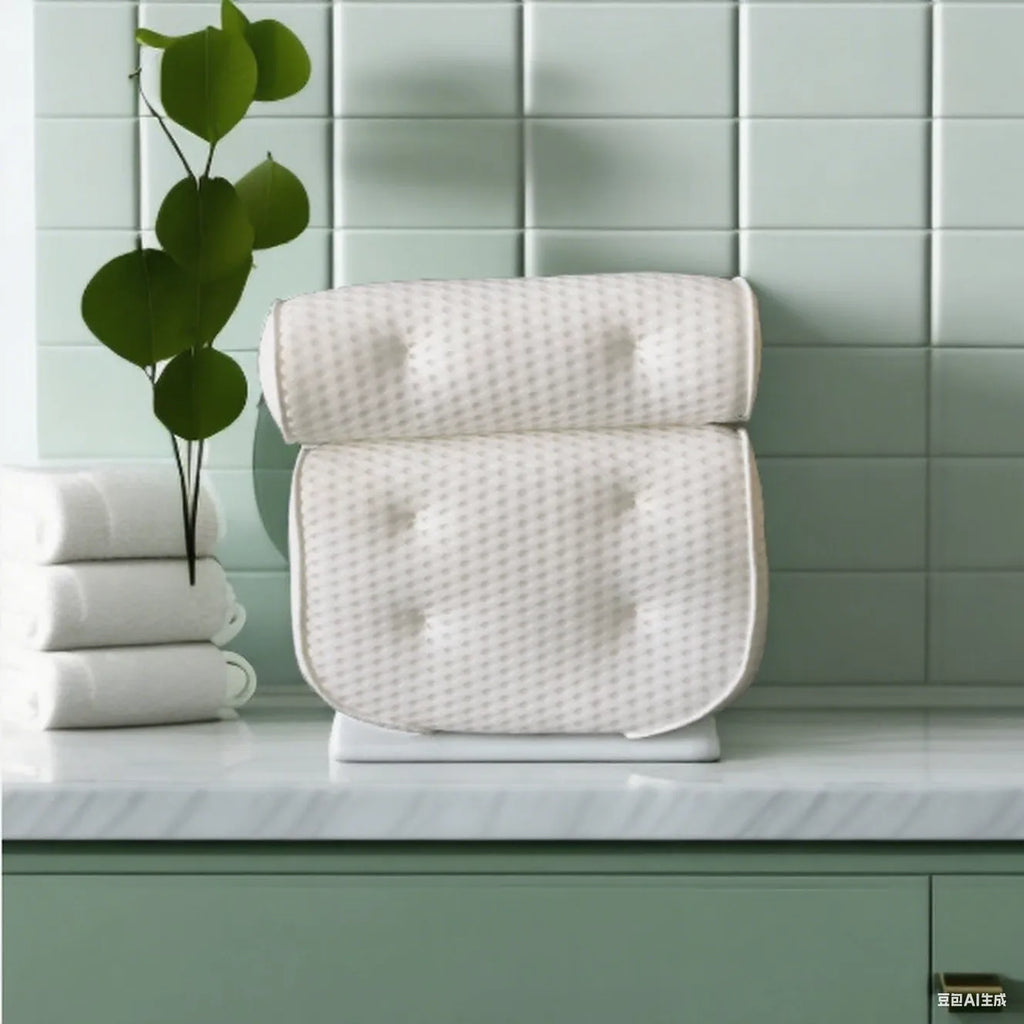 White bathtub pillow with mesh fabric and suction cups on a bath mat.
