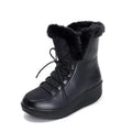 Black women's lace-up winter boots with platform sole on a white background