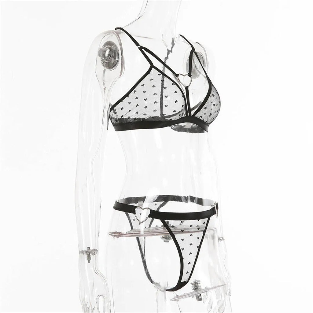 Ladies' black mesh two-piece sports top and trousers set on a hanger