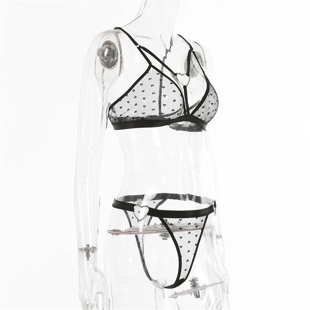 Ladies' black mesh two-piece sports top and trousers set on a hanger