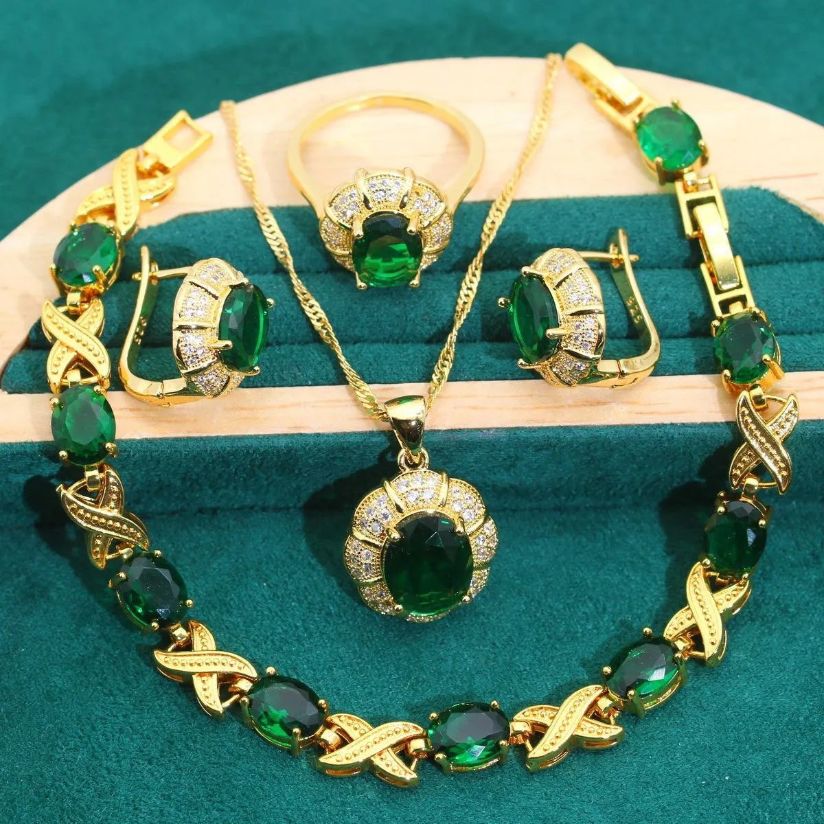 18k gold plated jewellery set with cubic zirconia stones showing necklace, earrings, ring and bracelet