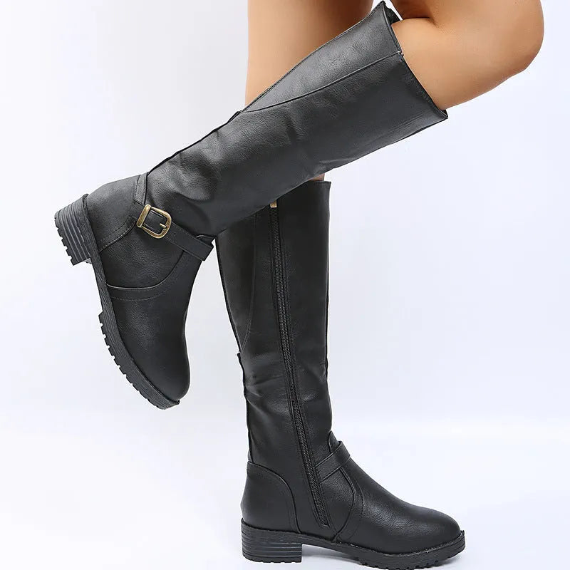 Women's black knight boots with a square heel, round toe, and decorative buckle.
