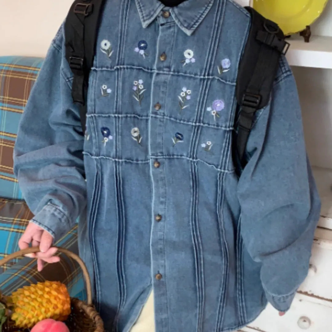 Vintage washed blue denim shirt with small floral print and pleated detail, long sleeves with button front