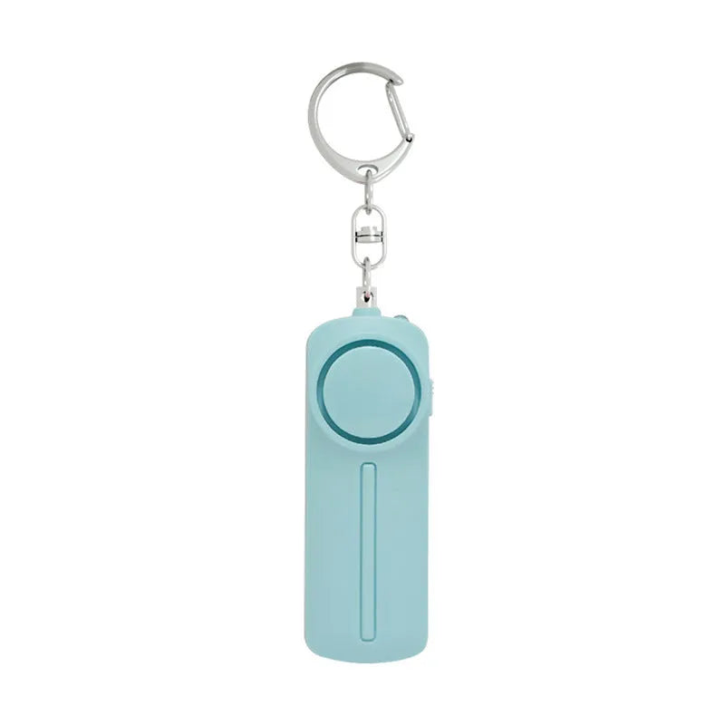 Compact pink personal safety alarm with keyring, shown at 86mm long.