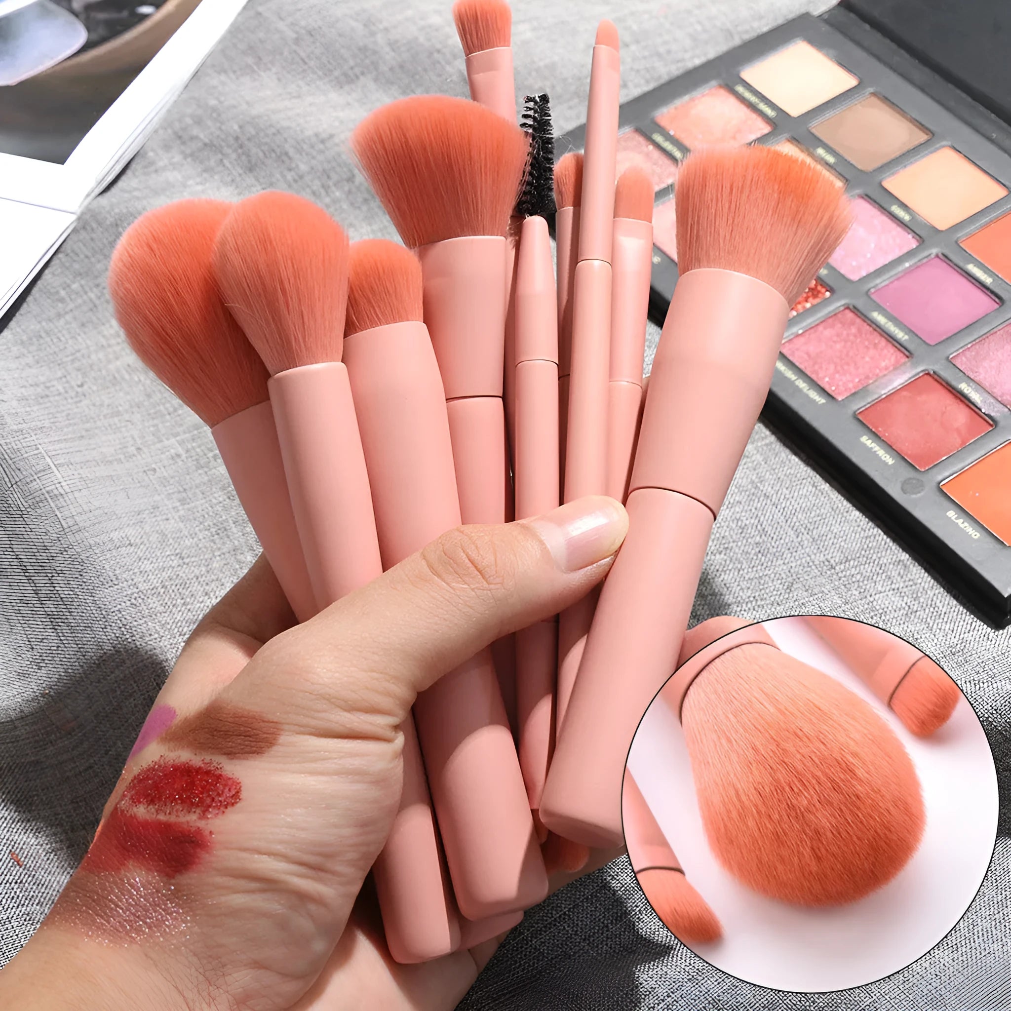Open case showing 10 pink-handled makeup brushes including loose powder, foundation, flat head, and double-ended brushes.