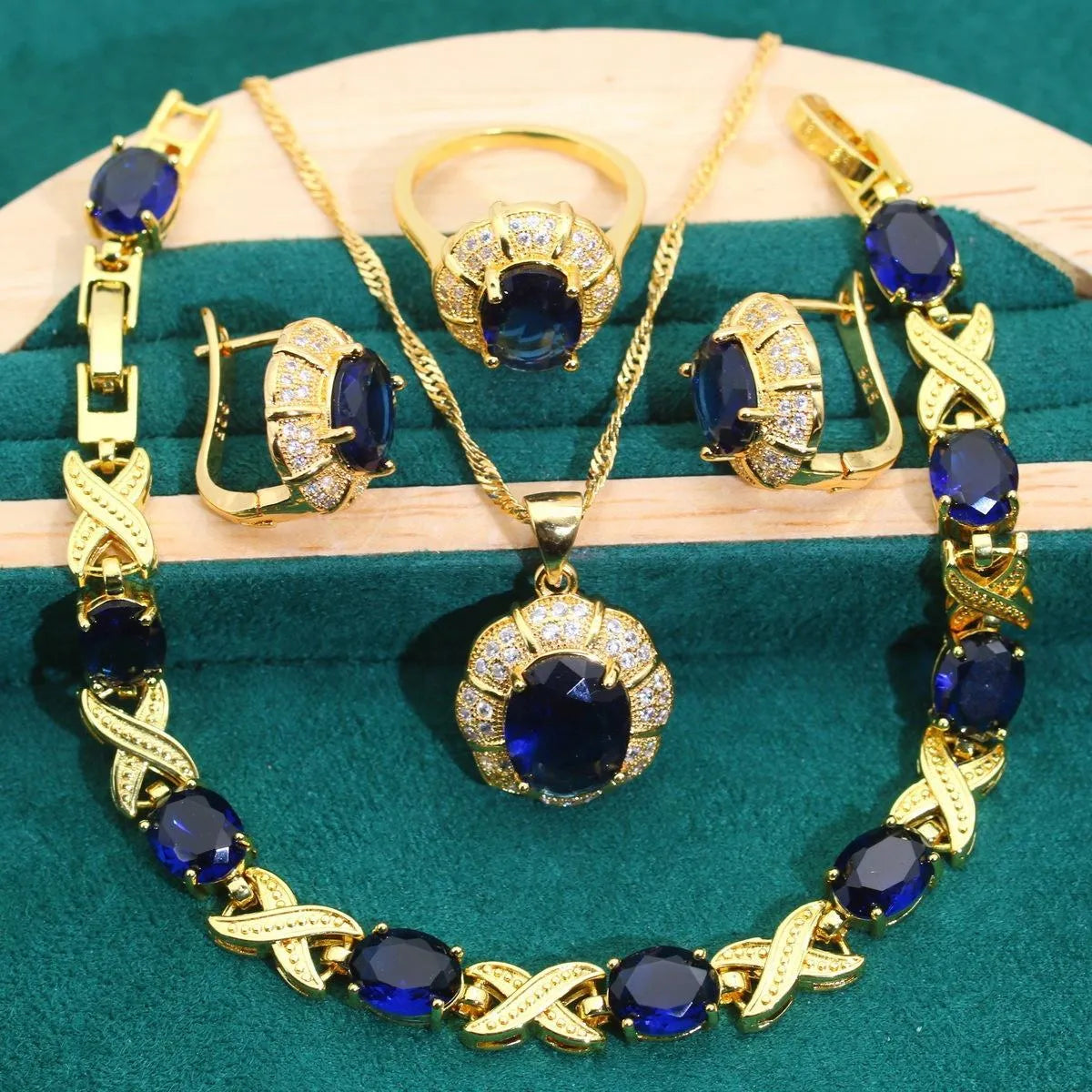 18k gold plated jewellery set with cubic zirconia stones showing necklace, earrings, ring and bracelet