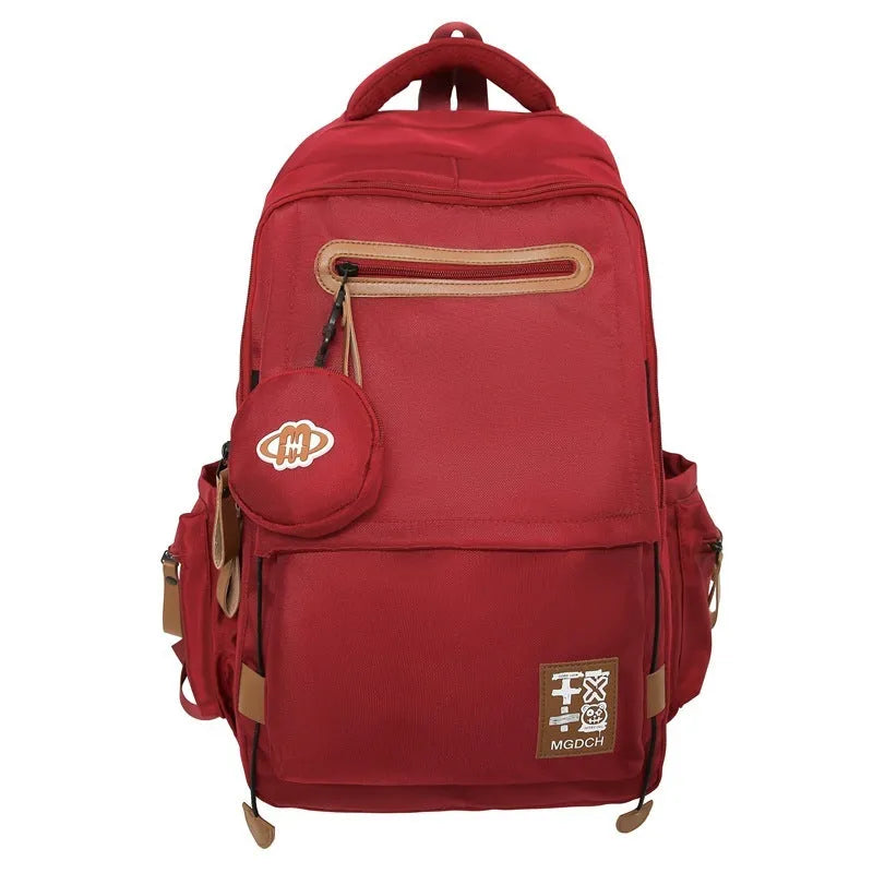Large nylon school backpack in blue with curved shoulder straps and street style sewing detail