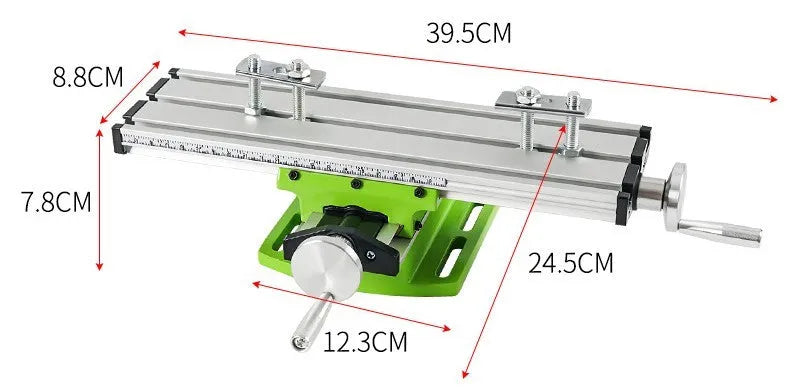 Bench drill milling machine on a workbench with cross bench pliers.