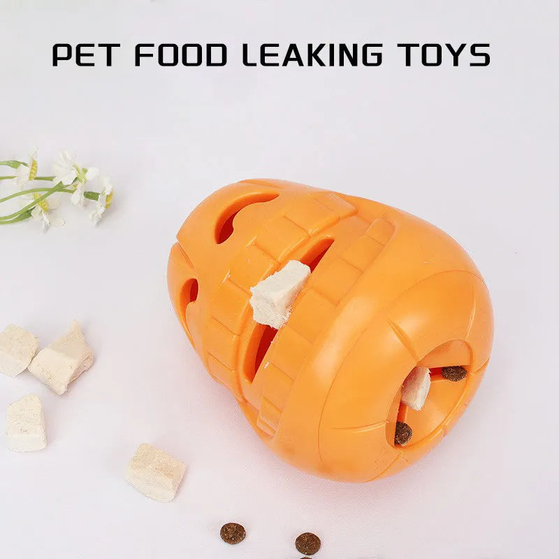 Orange Halloween pumpkin shaped durable rubber dog toy with a treat-dispensing funnel opening.