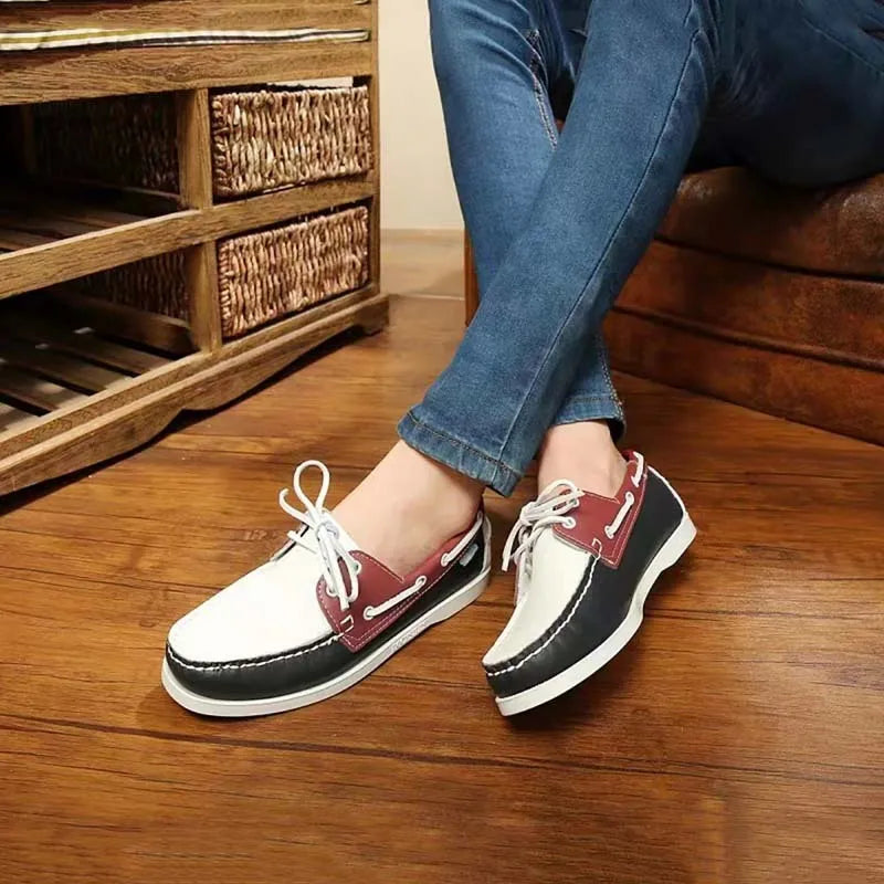 Men's black casual shoes with round toe, flat heel, and lace-up design on a white background.