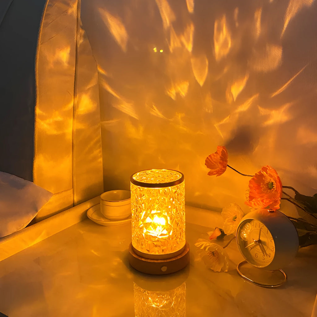 Rotating water ripple touch night light with acrylic body and solid wood base.
