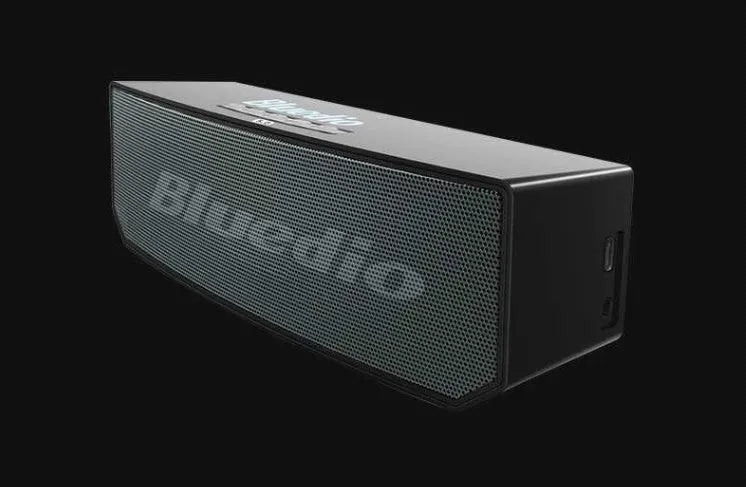 Black cloud smart speaker with 52mm driver showing micro-USB charging port