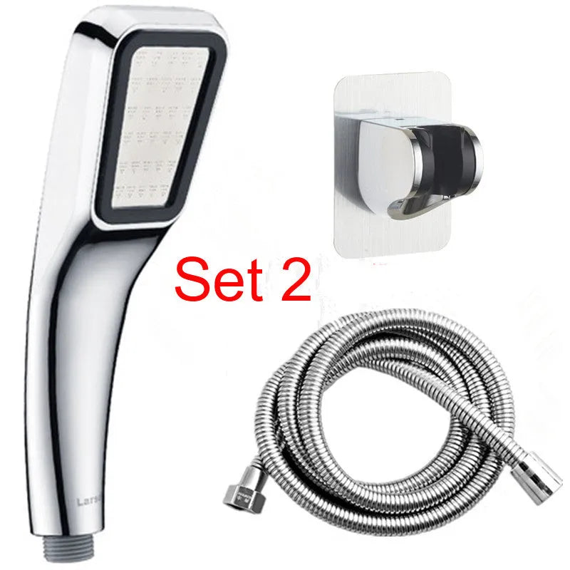 Orange hand-held pressurised shower head with rain function, part of a complete shower set